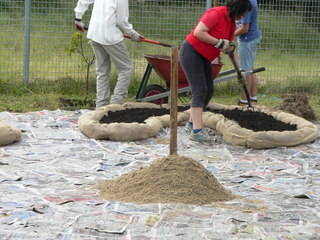 Sand in the centre of the mandala garden ready for the herb spiral