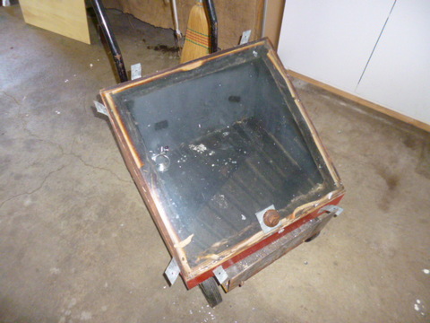 The carcase of the oven with reflector attachments in place