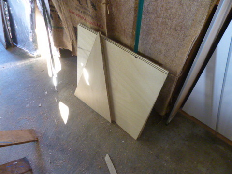 The plywood reflectors cut out and ready to coat