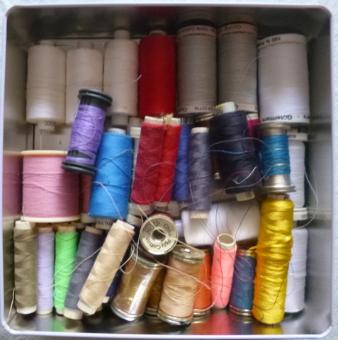 A tin of various threads is a good investment
