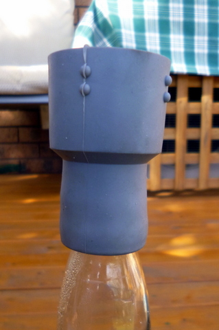 Rubber cuff over the neck of the bottle