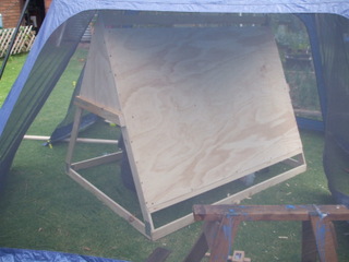 The back goes on (we were expsecting rain and worked inside a tent)