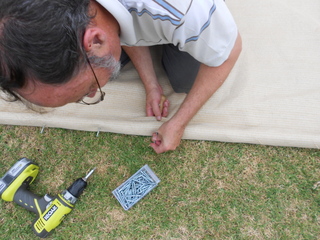 Using the Bradawl to locate the screw