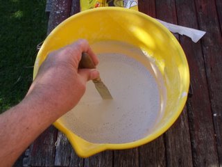 Mixing the plaster into the water