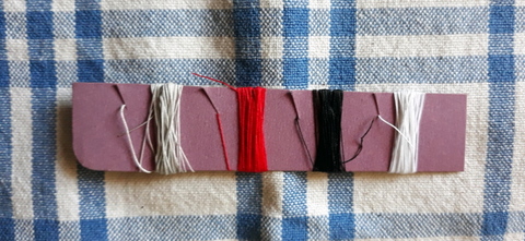 Thread on cardboard